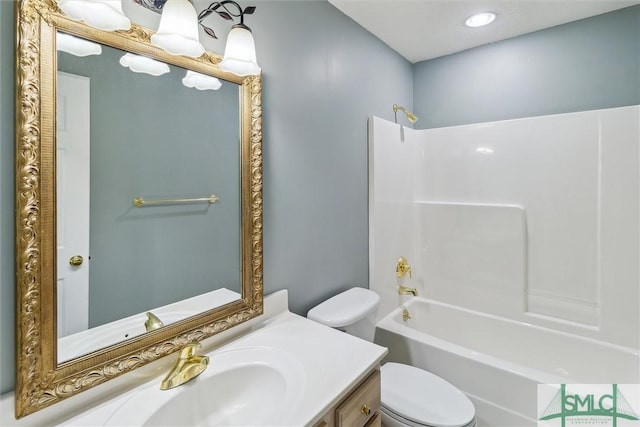 bathroom with shower / bath combination, vanity, and toilet