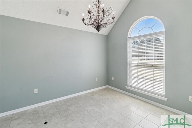 spare room featuring an inviting chandelier, baseboards, visible vents, and vaulted ceiling