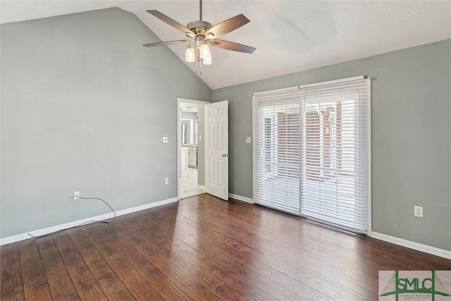 unfurnished bedroom featuring access to outside, lofted ceiling, baseboards, and wood finished floors