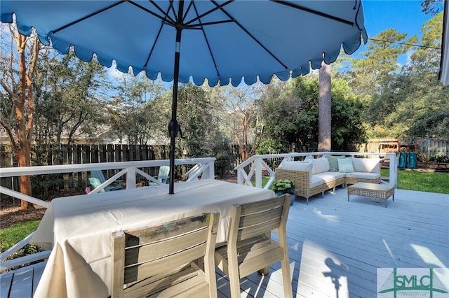 deck featuring fence and outdoor lounge area