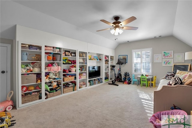 game room with ceiling fan, carpet, visible vents, and vaulted ceiling