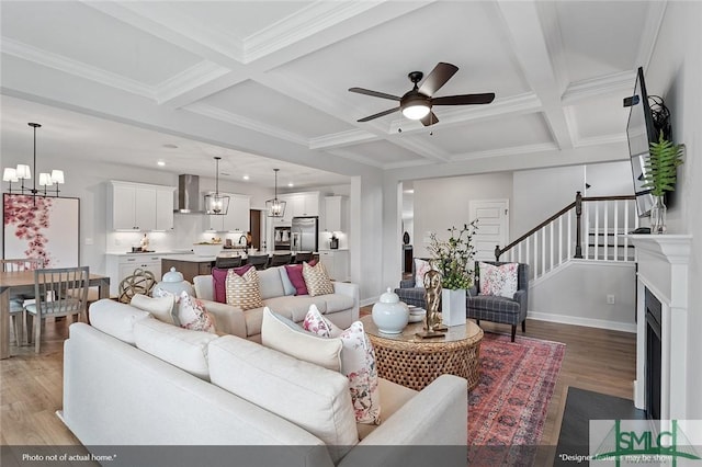 living room with light wood-type flooring, coffered ceiling, stairway, and baseboards