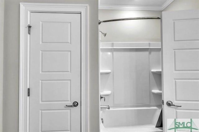 bathroom with tub / shower combination and crown molding