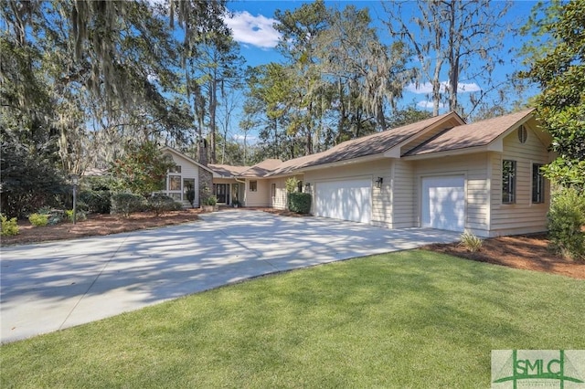 ranch-style house with a garage, a front yard, and driveway