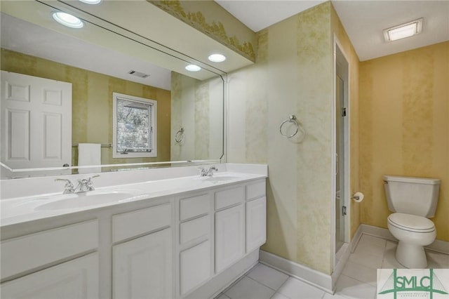 full bath featuring toilet, visible vents, a sink, and tile patterned floors