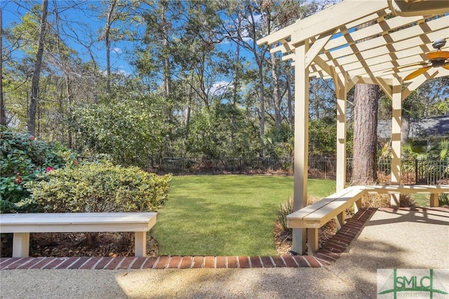 view of yard with fence and a pergola