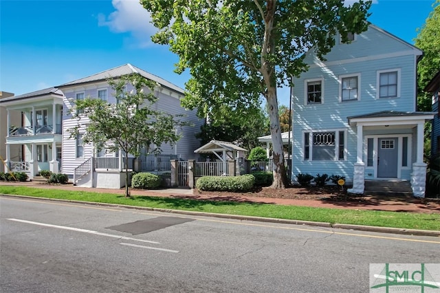 view of front of home featuring fence