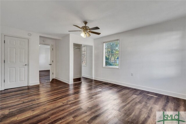 unfurnished bedroom with a closet, ceiling fan, baseboards, and wood finished floors