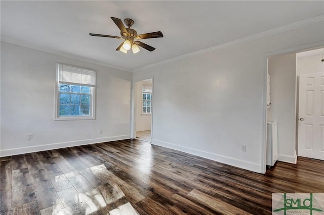 unfurnished room featuring crown molding, baseboards, ceiling fan, and wood finished floors