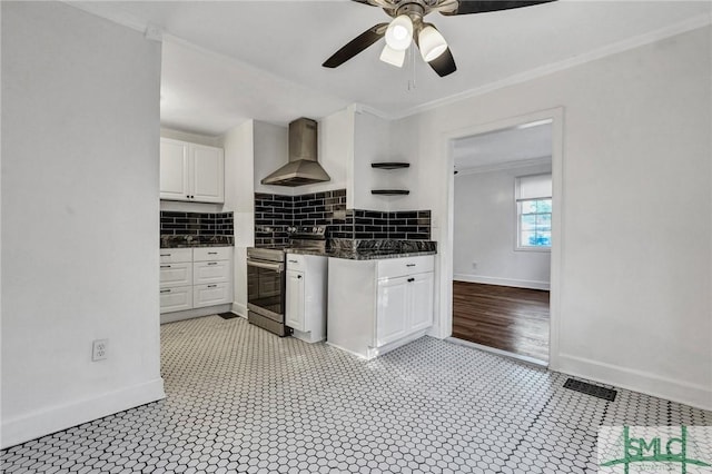 kitchen with decorative backsplash, electric stove, wall chimney exhaust hood, crown molding, and white cabinetry