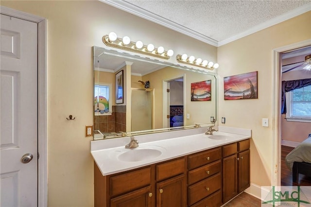 bathroom with a sink, a textured ceiling, ensuite bath, and a shower stall