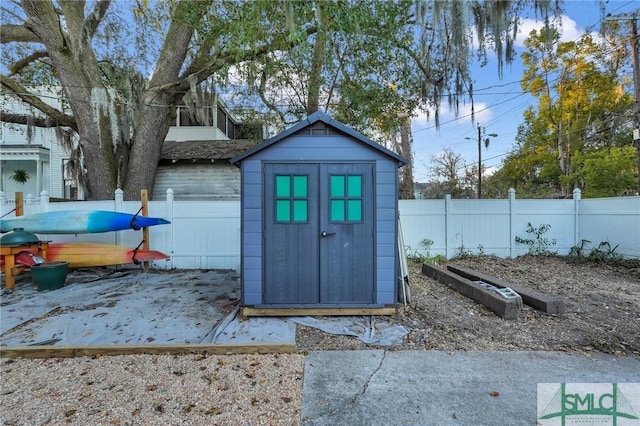 view of shed with a fenced backyard