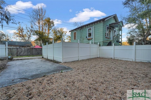 exterior space with a patio area and a fenced backyard