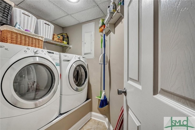 clothes washing area with laundry area, independent washer and dryer, and baseboards