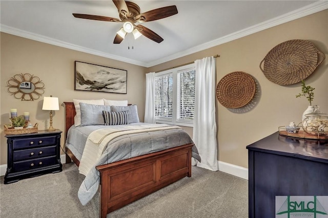 carpeted bedroom featuring ceiling fan, ornamental molding, and baseboards