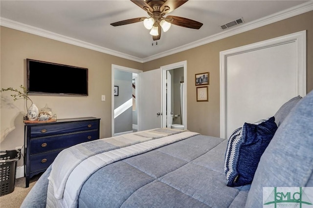 bedroom with carpet floors, crown molding, visible vents, ceiling fan, and ensuite bath