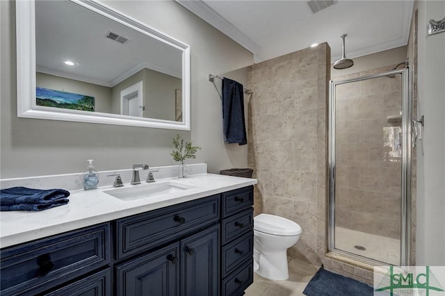 bathroom featuring toilet, a stall shower, vanity, and visible vents