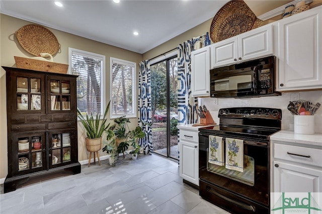 kitchen featuring black appliances, tasteful backsplash, white cabinets, and crown molding