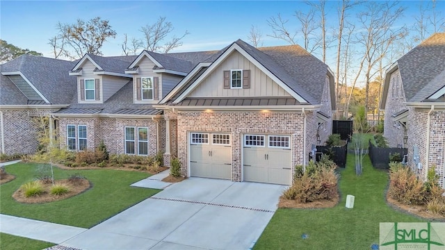 view of front of property with a standing seam roof, a front lawn, board and batten siding, and brick siding