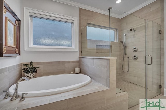 bathroom featuring a garden tub, ornamental molding, a shower stall, and a healthy amount of sunlight