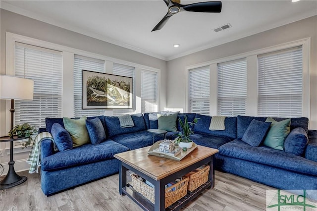 living room with visible vents, a ceiling fan, ornamental molding, wood finished floors, and recessed lighting