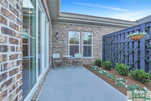 view of patio featuring fence