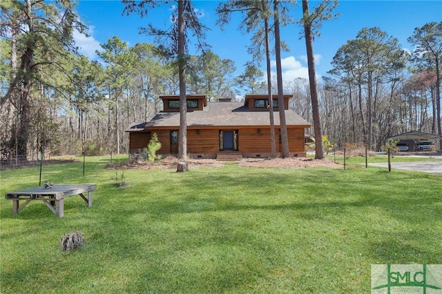 view of property exterior with a detached carport, crawl space, and a yard