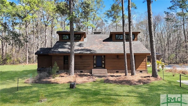 view of front of house with roof with shingles, crawl space, and a front yard