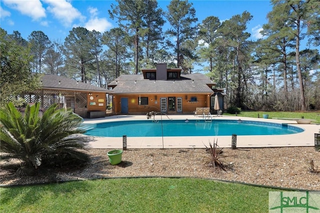 pool featuring french doors and a patio