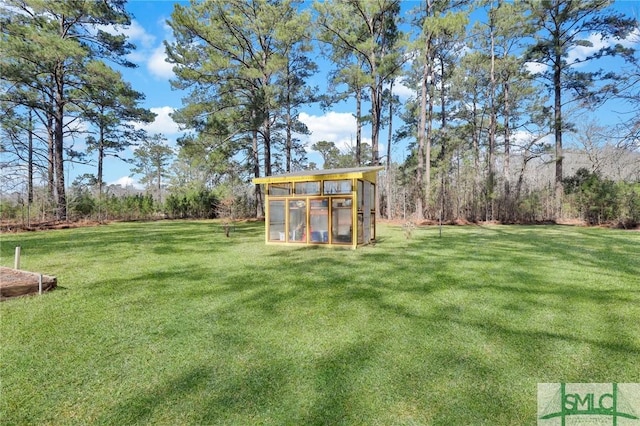 view of yard with an outdoor structure and an exterior structure