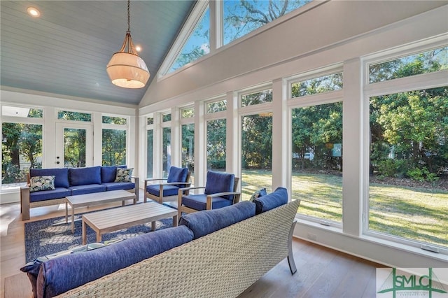 sunroom featuring lofted ceiling