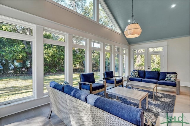 sunroom / solarium with lofted ceiling and a wealth of natural light