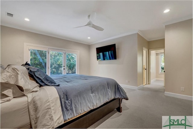 bedroom featuring carpet, visible vents, baseboards, and ornamental molding