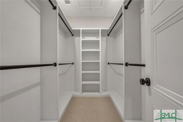 spacious closet with attic access and visible vents