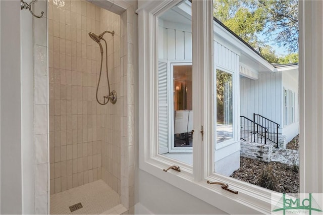 bathroom with a tile shower