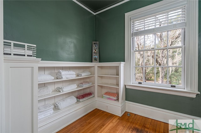 interior space featuring hardwood / wood-style flooring and baseboards