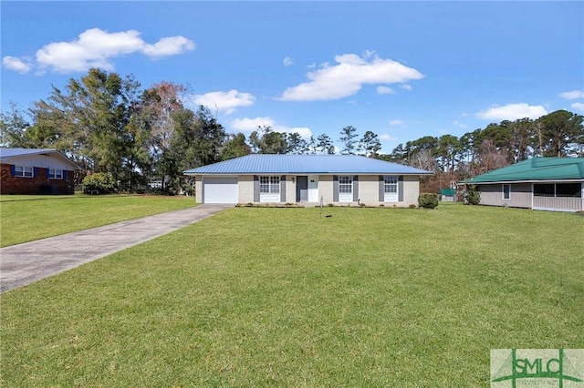 ranch-style house with an attached garage, concrete driveway, and a front yard