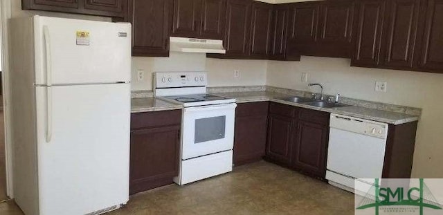 kitchen featuring white appliances, under cabinet range hood, light countertops, and a sink