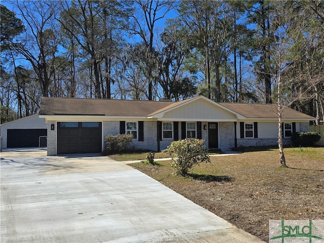 ranch-style house featuring driveway, brick siding, and an attached garage