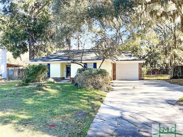 single story home featuring an attached garage, brick siding, fence, concrete driveway, and a front yard