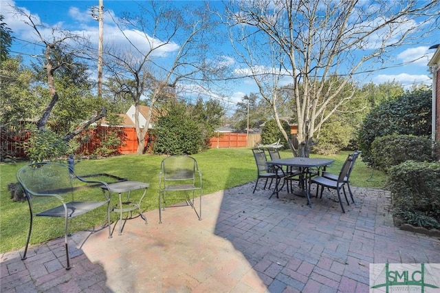 view of patio / terrace featuring fence and outdoor dining area