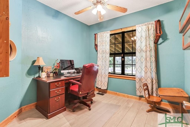 720 Old Dixie Hwy S, Springfield, GA 31329 - office space featuring light wood-style flooring, baseboards, a ceiling fan, and a textured wall