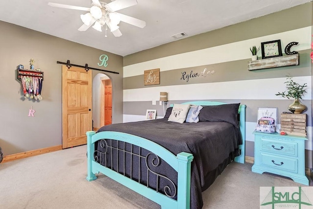 720 Old Dixie Hwy S, Springfield, GA 31329 - carpeted bedroom with arched walkways, ceiling fan, visible vents, and baseboards