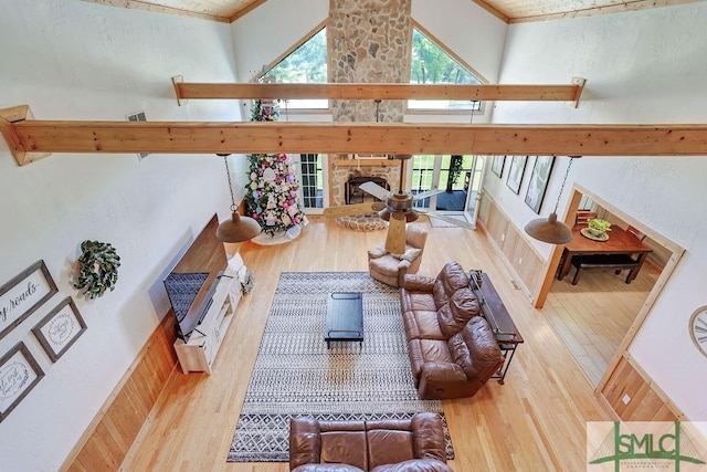 720 Old Dixie Hwy S, Springfield, GA 31329 - living room with crown molding, a fireplace, a towering ceiling, and wood finished floors