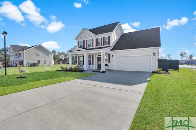 view of front of house with a garage, concrete driveway, and a front lawn