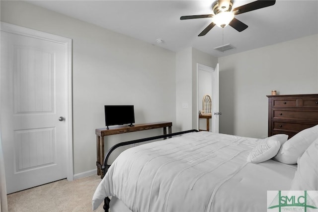 bedroom with baseboards, ceiling fan, visible vents, and light colored carpet