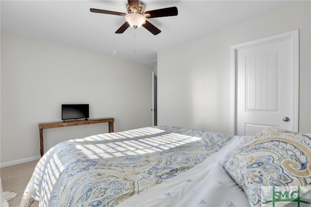 bedroom with carpet floors, baseboards, and a ceiling fan