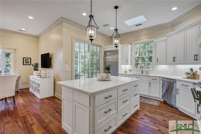 kitchen with dishwasher, a skylight, a sink, and crown molding