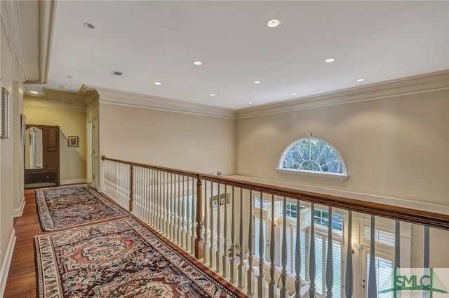 hall with recessed lighting, attic access, ornamental molding, wood finished floors, and baseboards