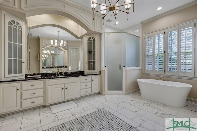 bathroom featuring a stall shower, marble finish floor, vanity, and an inviting chandelier